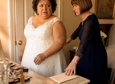 In a bridal suite, the bride stares at a sealed envelope as her future mother-in-law locks the door.
